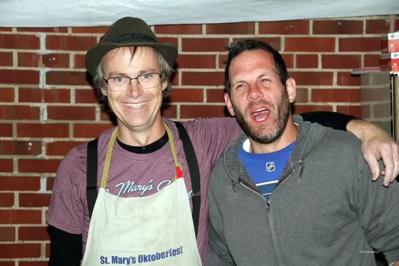 Longtime Oktoberfest volunteers and parish friends smiling together
