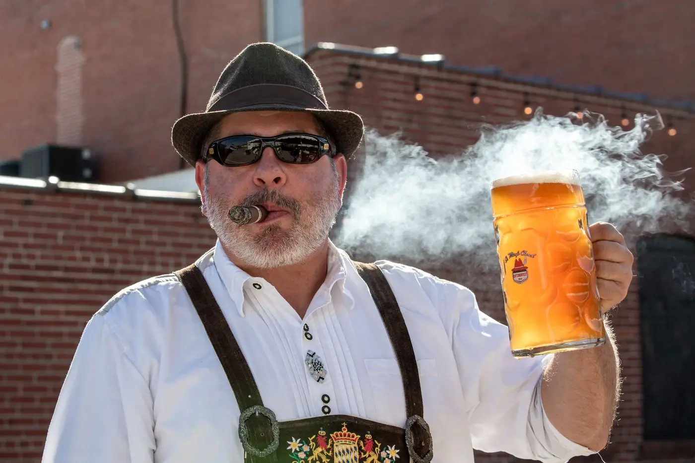 Guest holding a full Oktoberfest stein