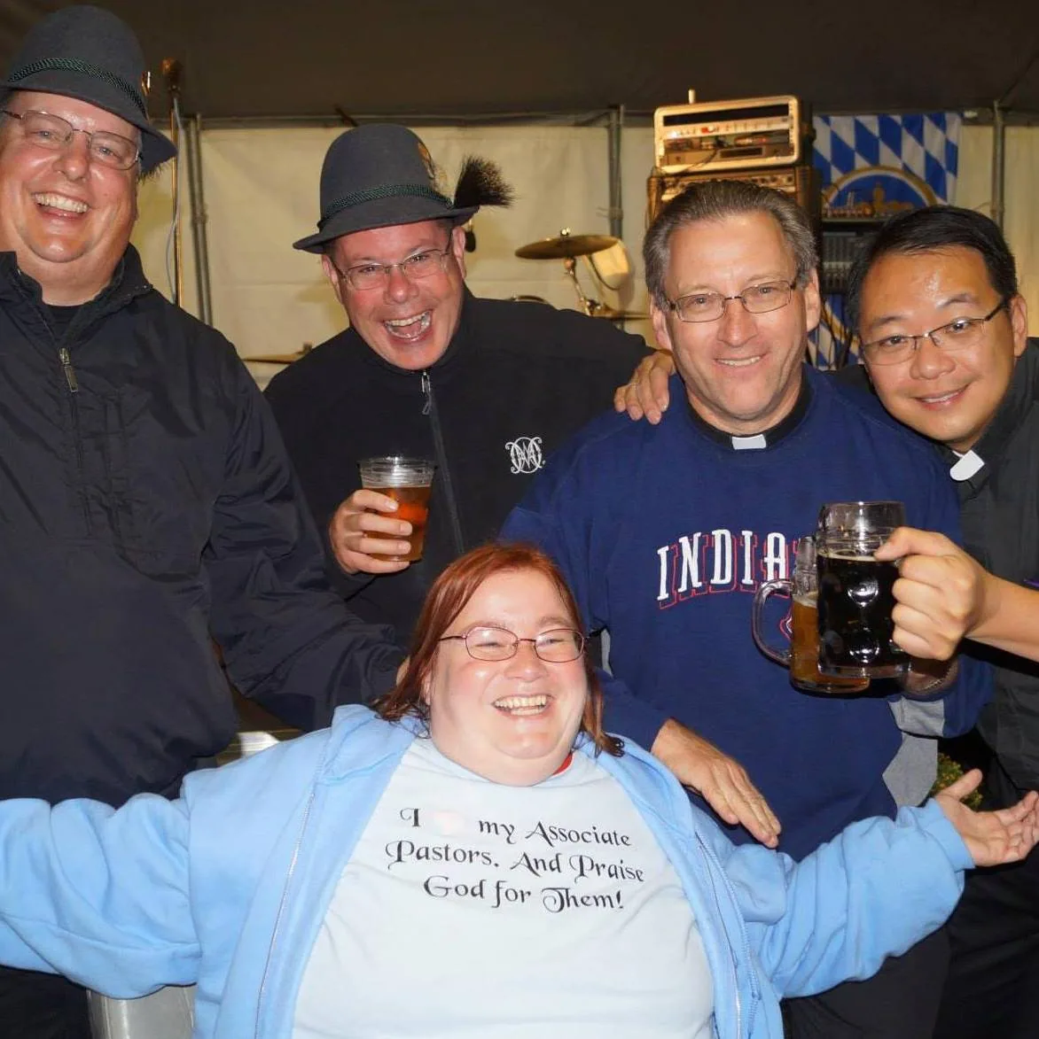 Oblate priests and parishioners gathered under the Oktoberfest tent