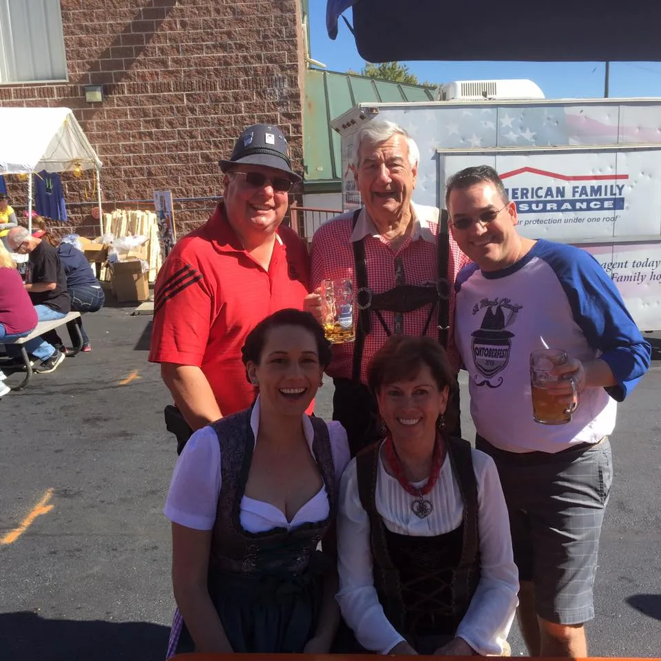 Oktoberfest guests and clergy holding steins