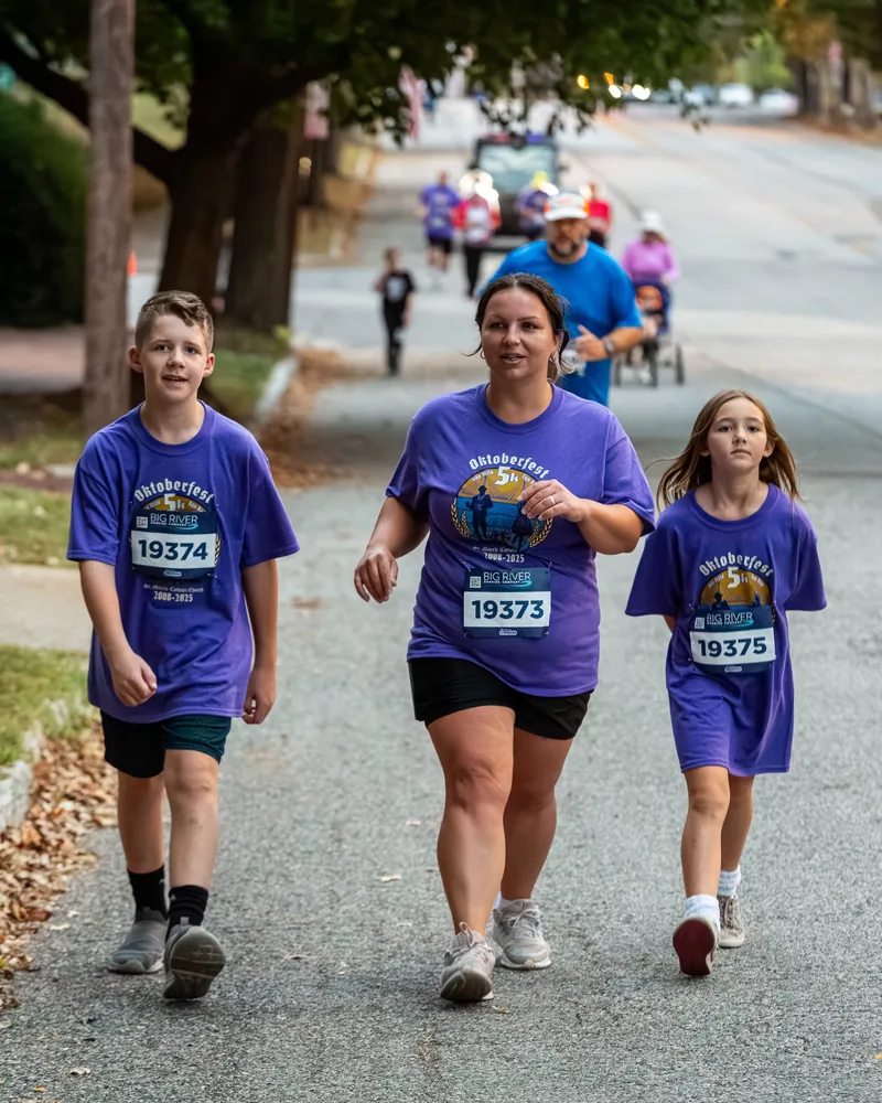 Family walking the Oktoberfest 5K and fun run route