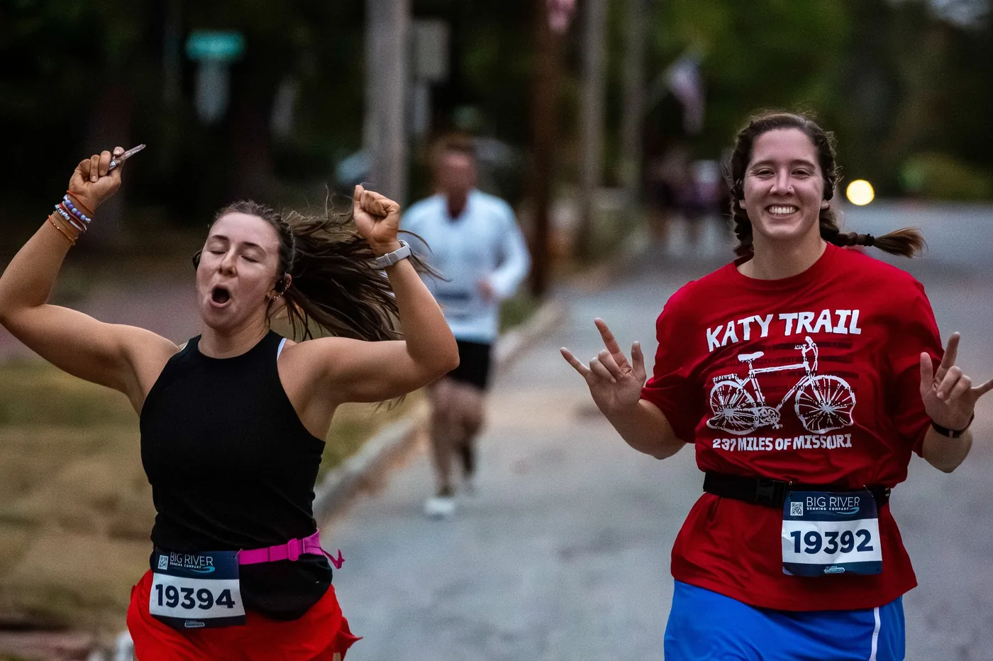 Two runners celebrating during the Oktoberfest 5K