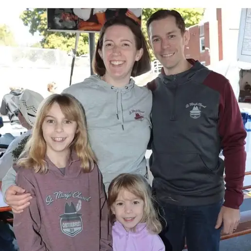 Event chair family representing the parish community behind Oktoberfest sponsorship